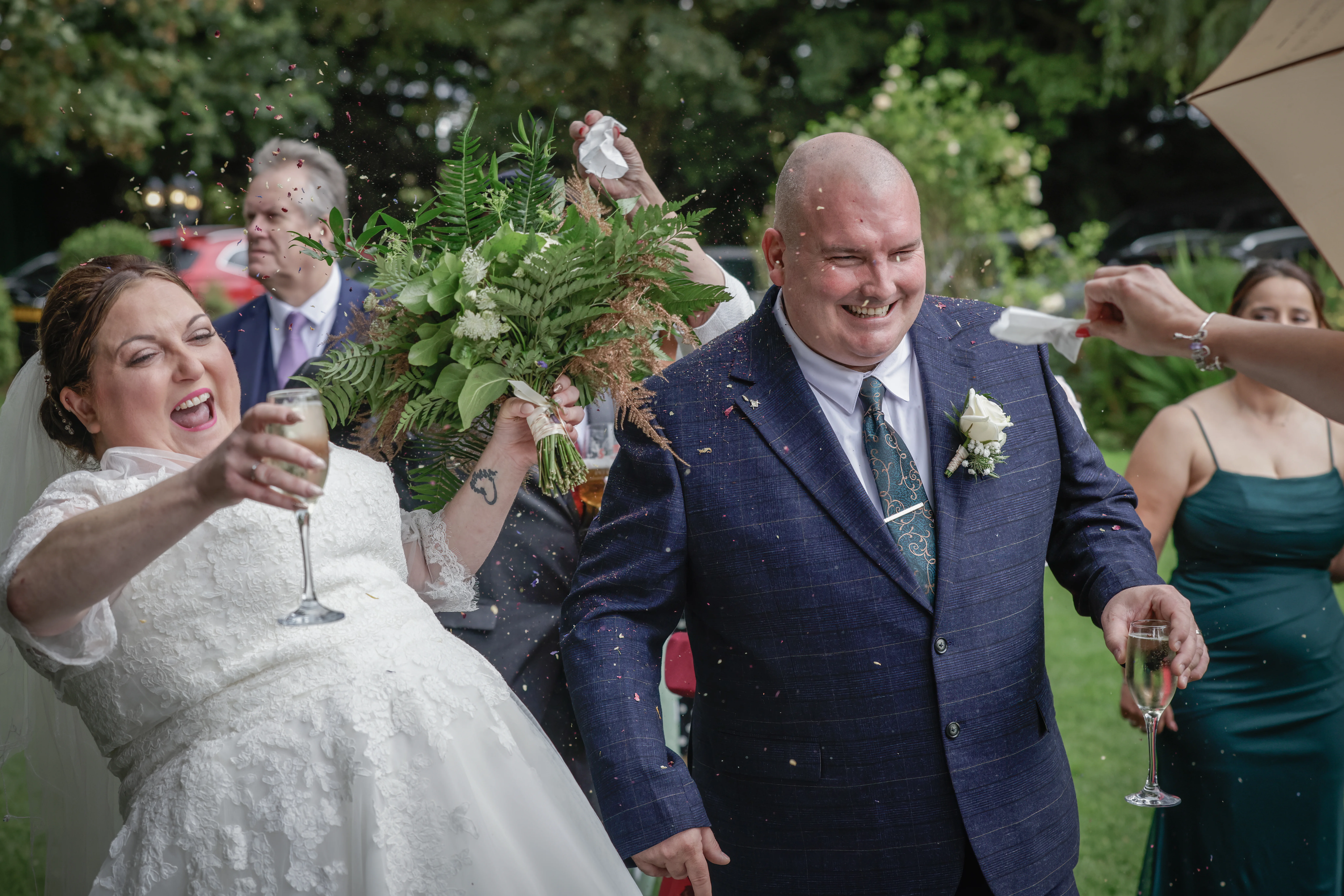 Joyful newlyweds celebrating with confetti